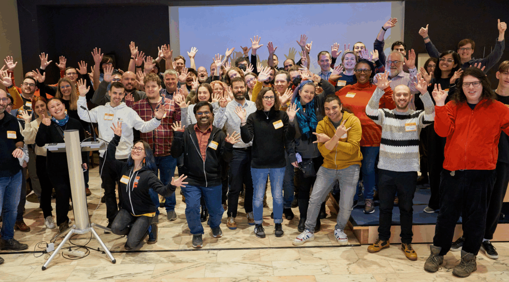 A bunch of CHAOTICs at CHAOSScon EU with our hands in the air.