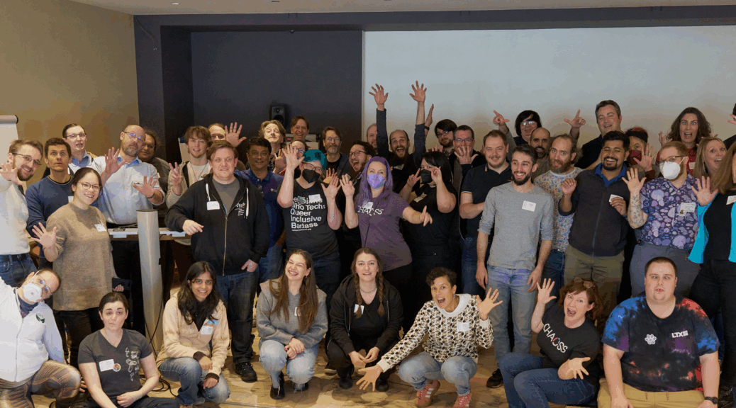 A bunch of people having a great time in a fun picture from CHAOSScon EU